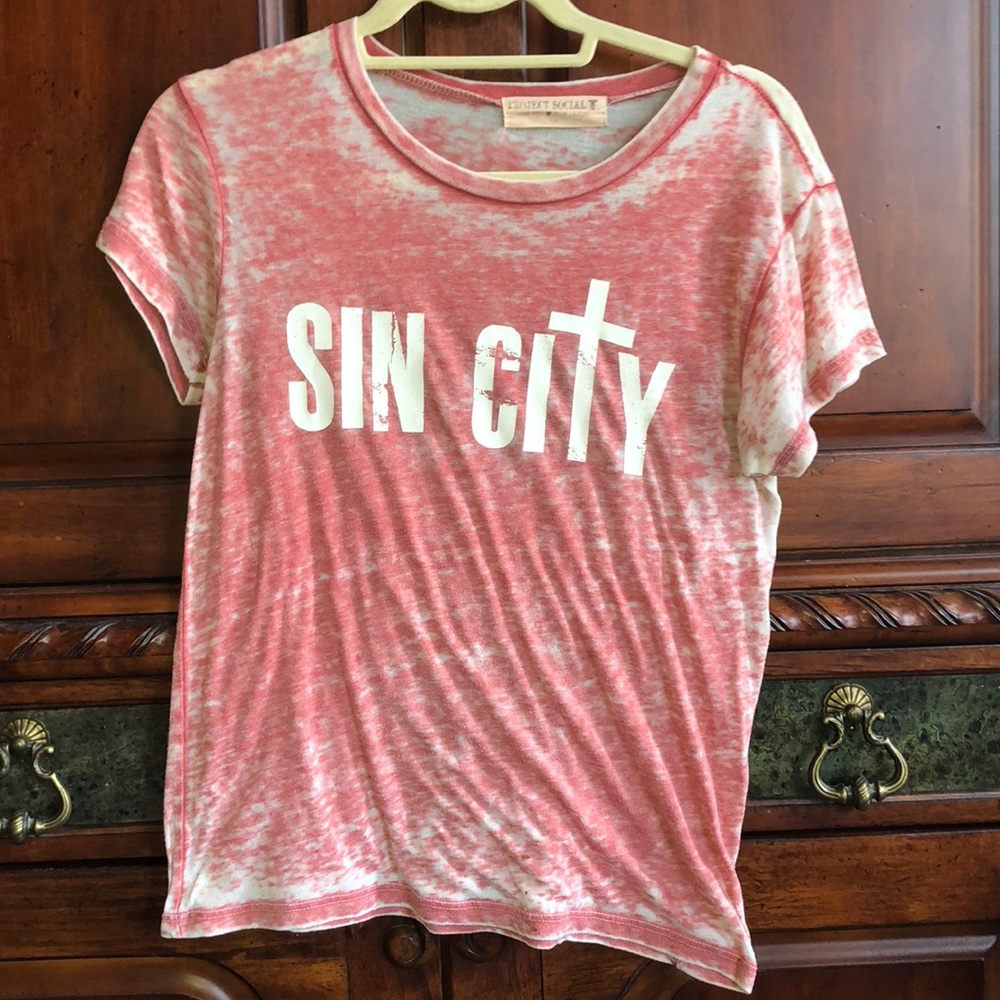 A shirt that says “sin city” from project social T